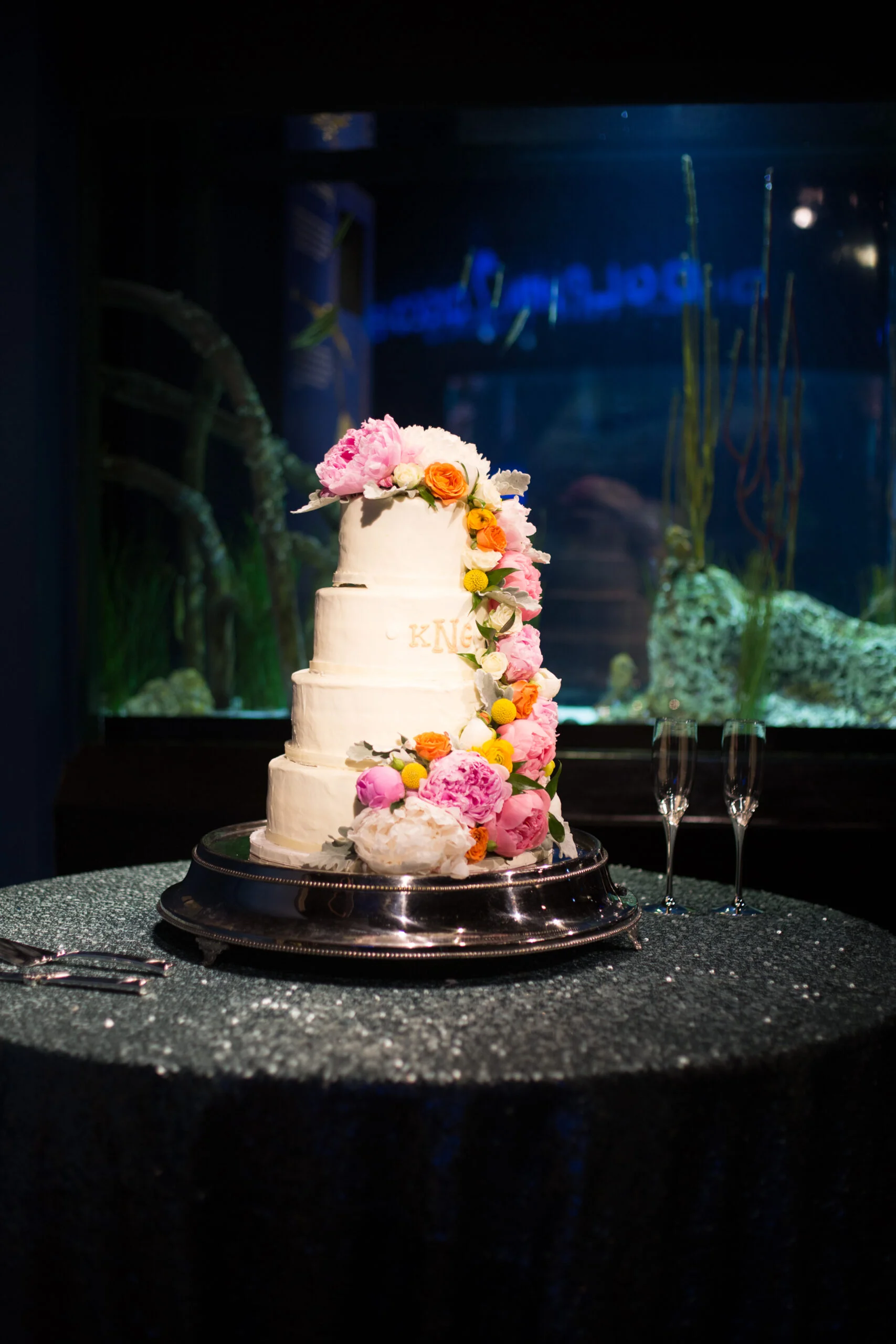 Wilmington Uplighting wedding cake pin spot lighting at NC aquarium at fort fisher